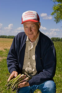 Steve Garrison, Prof. Emeritus, with asparagus spears.